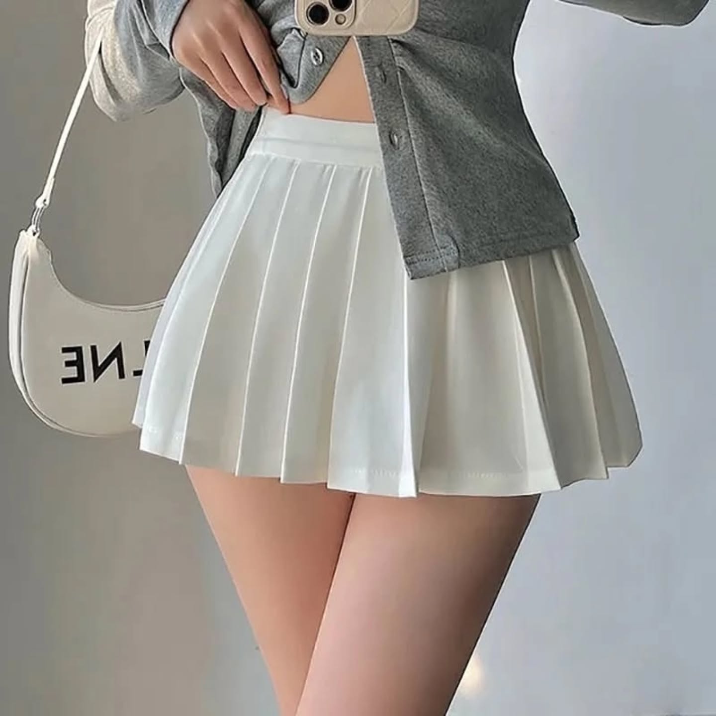 Mini falda blanca plisada holgada
